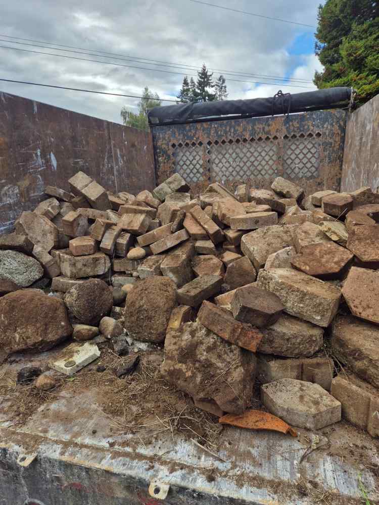 Truck bed loaded with bricks, pavers and concrete rubble
